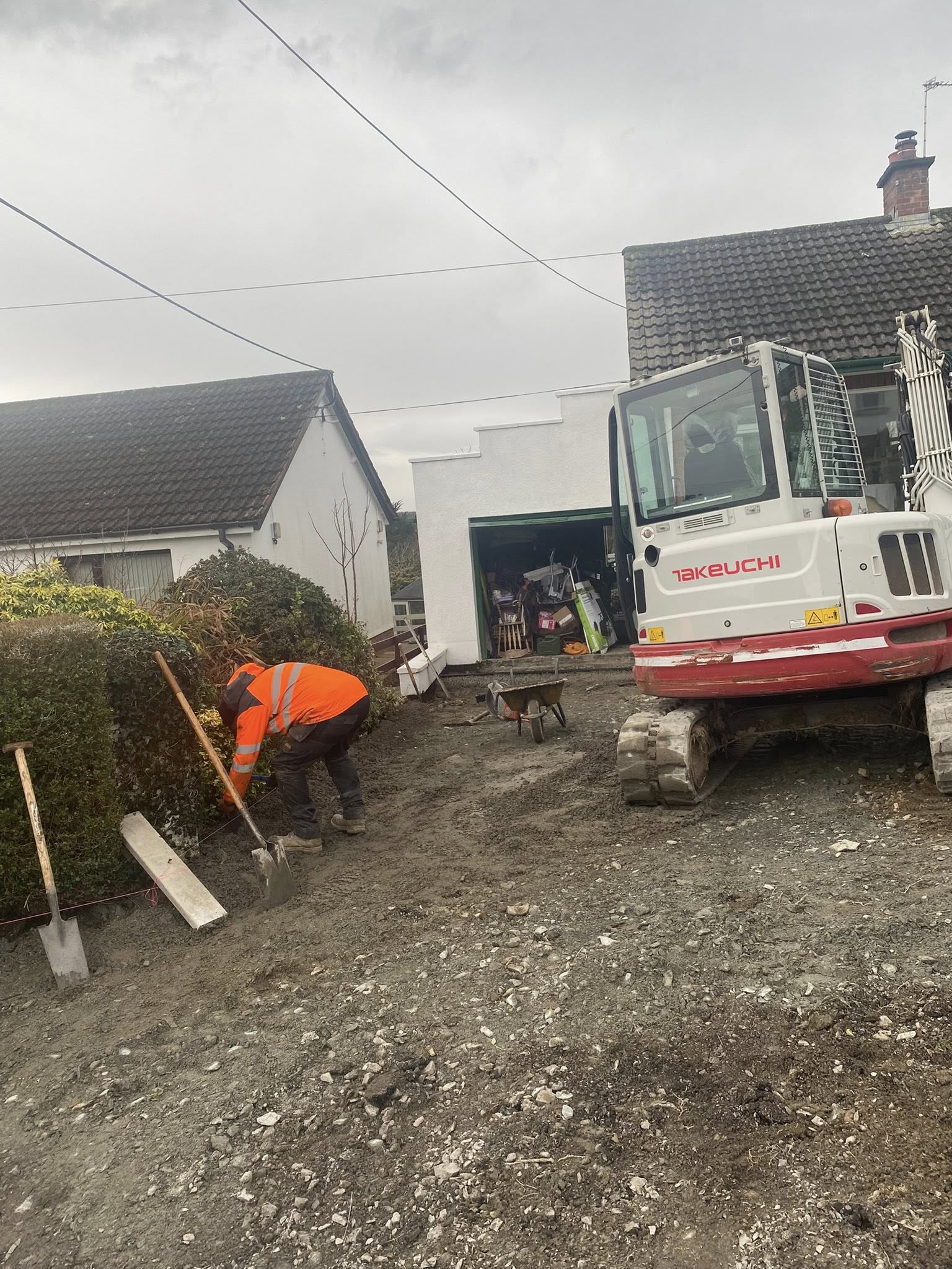 Professional asphalt finish across a rural entrance